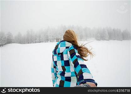 Woman enjoying snow, Sattelbergalm, Tirol, Austria
