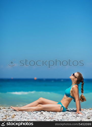 Woman enjoying sunshine on beach