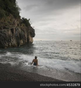 Woman enjoying the beach, Positano, Amalfi Coast, Salerno, Campania, Italy