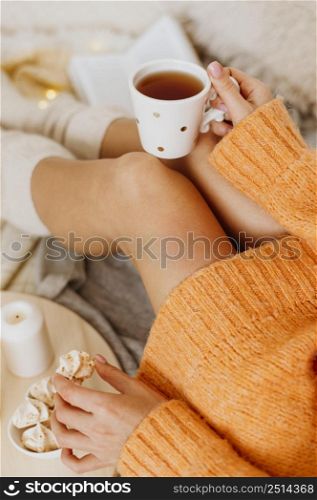 woman enjoying winter holidays with cup tea