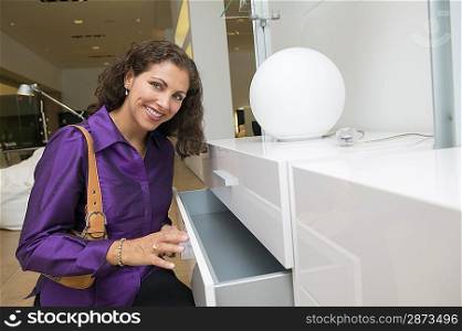 Woman Examining White Dresser