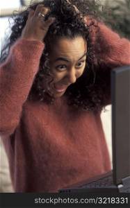 Woman excited At Her Computer