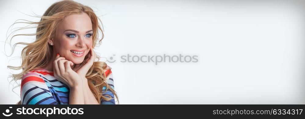 Woman excited looking to the side. Surprised happy young woman looking sideways in excitement, isolated on white