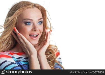 Woman excited looking to the side. Surprised happy young woman looking sideways in excitement, isolated on white