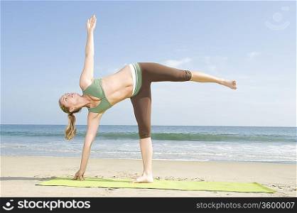 Woman exercising at beach