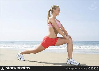 Woman exercising at beach