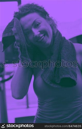 woman exercising on treadmill in gym. sport, fitness, lifestyle, technology and people concept - smiling woman exercising on treadmill in gym duo tone