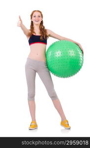 Woman exercising with swiss ball on white