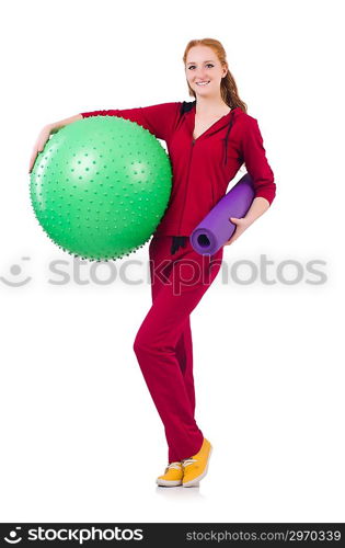 Woman exercising with swiss ball on white