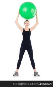 Woman exercising with swiss ball on white