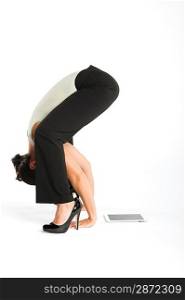 Woman exercising with tablet pc on side