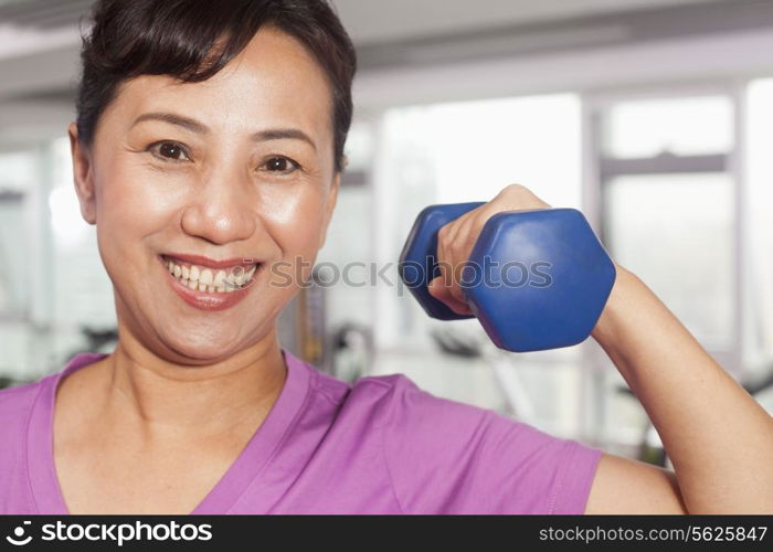 Woman exercising with weights