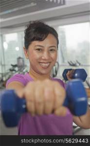Woman exercising with weights