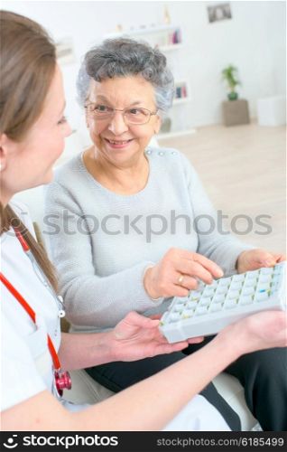 Woman explaining how medicine is organised