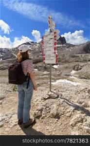 woman facing directions for trekking in Pale di San Martino mount