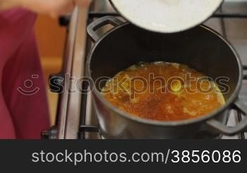 woman falls asleep rice in pan.