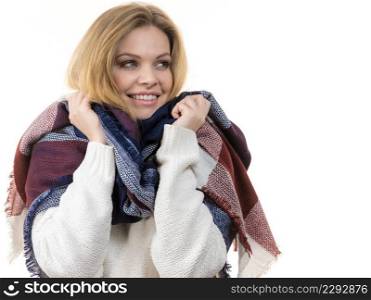 Woman feeling comfortable wearing her soft colorful warm autumnal shawl scarf. Autumn outfit accessories concept.. Woman wearing warm scarf