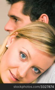 Woman feeling protected leaning at the shoulder of her guy