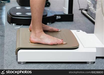 Woman Feet on Medical Professional Scale: Health Checks before Sport Activity