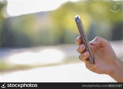 Woman finger touching the smart phone.