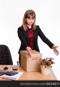 Woman fired from her job at the office and collect personal belongings and flower room. Girl in office grotyagivaet hands to indoor potted tsvutku