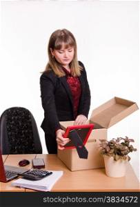 Woman fired or hired in the office and collect or parses personal belongings out of the box