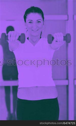 woman fitness workout with weights. beaudiful young woman fitness workout with weights at sport club duo tone