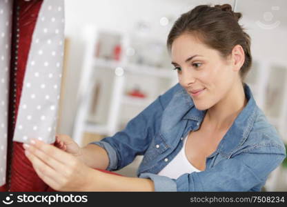 woman fixing a chair in the workshop