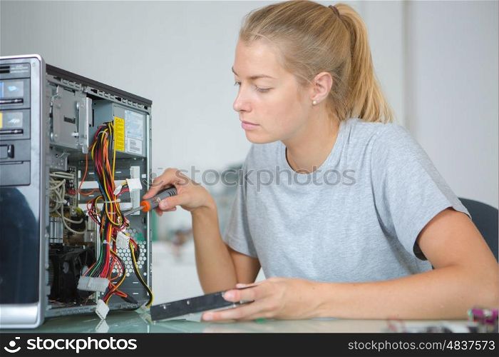 woman fixing a CPU