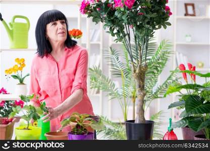 Woman florist working in the flower shop