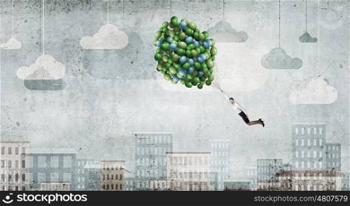 Woman fly in sky. Young businesswoman flying high in sky on bunch of balloons