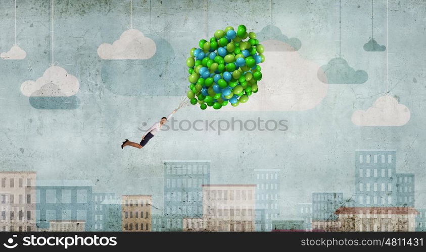 Woman fly in sky. Young businesswoman flying high in sky on bunch of balloons