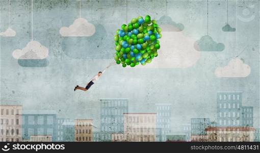 Woman fly in sky. Young businesswoman flying high in sky on bunch of balloons