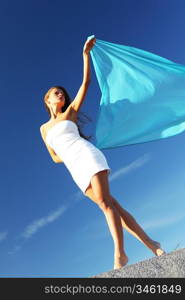 woman fly in the blue sky by fabric