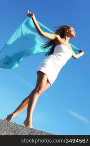 woman fly in the blue sky by fabric