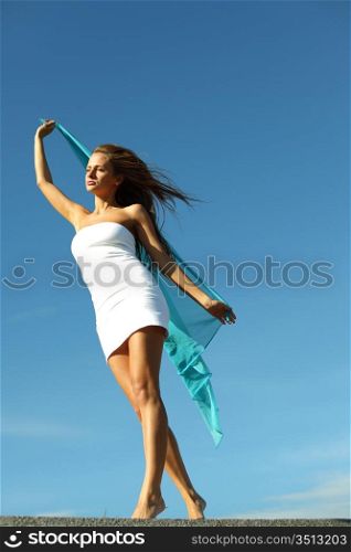 woman fly in the blue sky by fabric