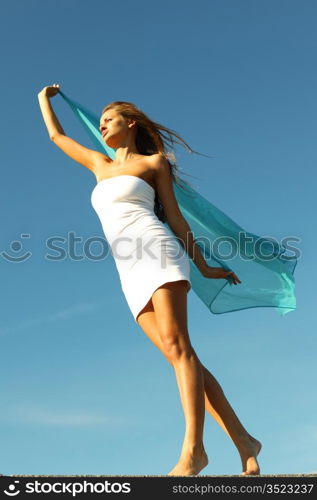 woman fly in the blue sky by fabric