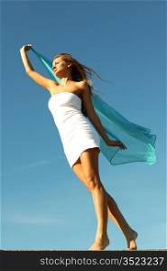 woman fly in the blue sky by fabric