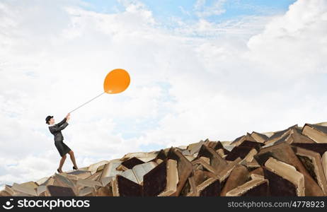 Woman fly on balloon. Businesswoman in suit and bowler hat flying on balloon
