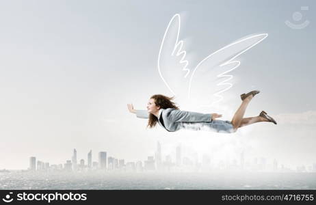 Woman flying high. Young businesswoman with drawn wings flying high in sky