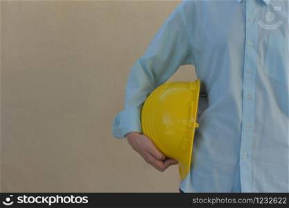 Woman Foreman holding hard hat contractor building construction