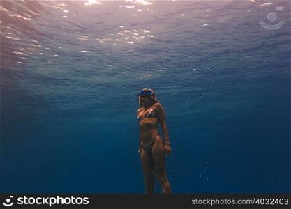 Woman free-diving in sea