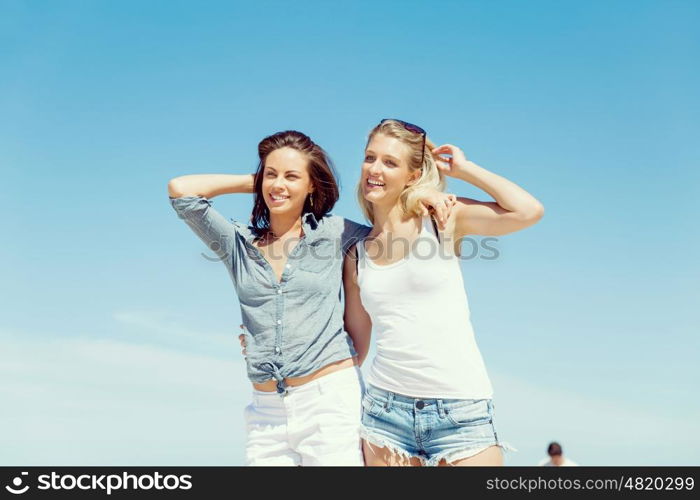 Woman friends on the beach. A picture of two women having good time on beach