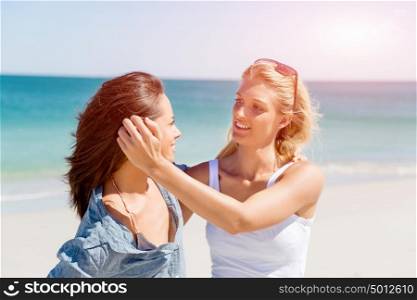 Woman friends on the beach. A picture of two women having good time on beach