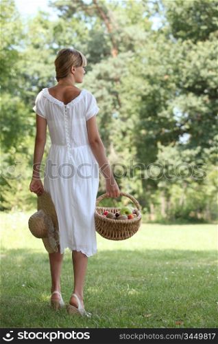 Woman from behind with fruit basket