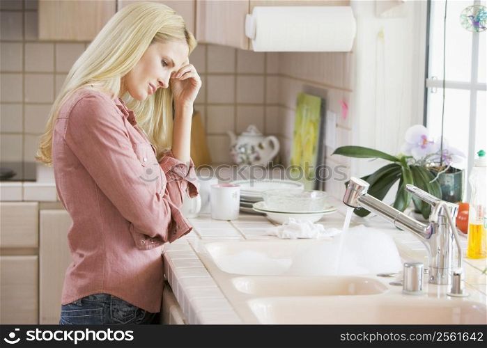Woman Frustrated At Kitchen Counter