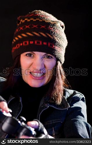 woman gamer with joystick on darken background