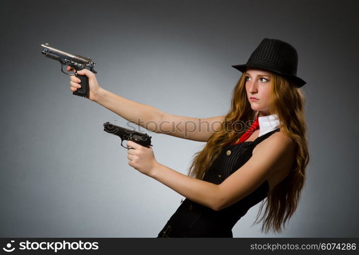 Woman gangster with gun in hand