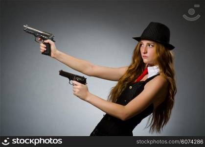 Woman gangster with gun in hand