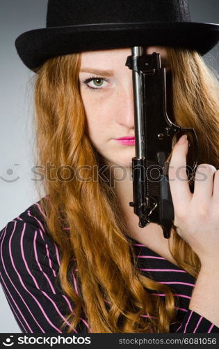 Woman gangster with gun in vintage concept